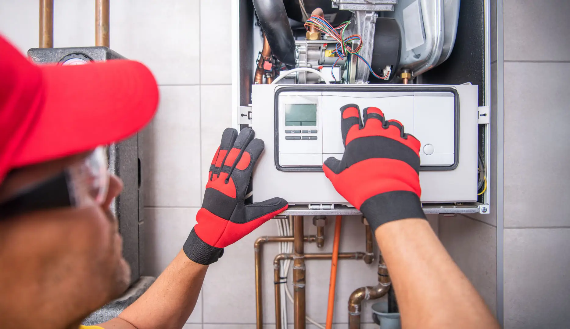 Gas Heater Repairing Performed by Caucasian Technician.