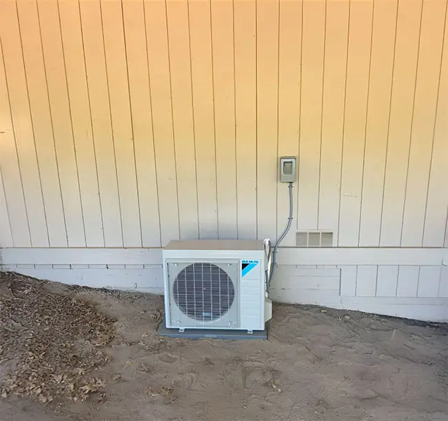 Single AC unit outside a home.