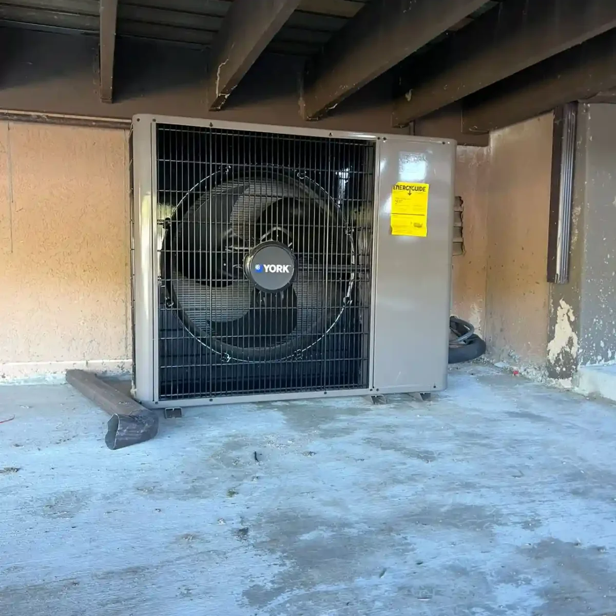 Ductless air conditioning system under a house.