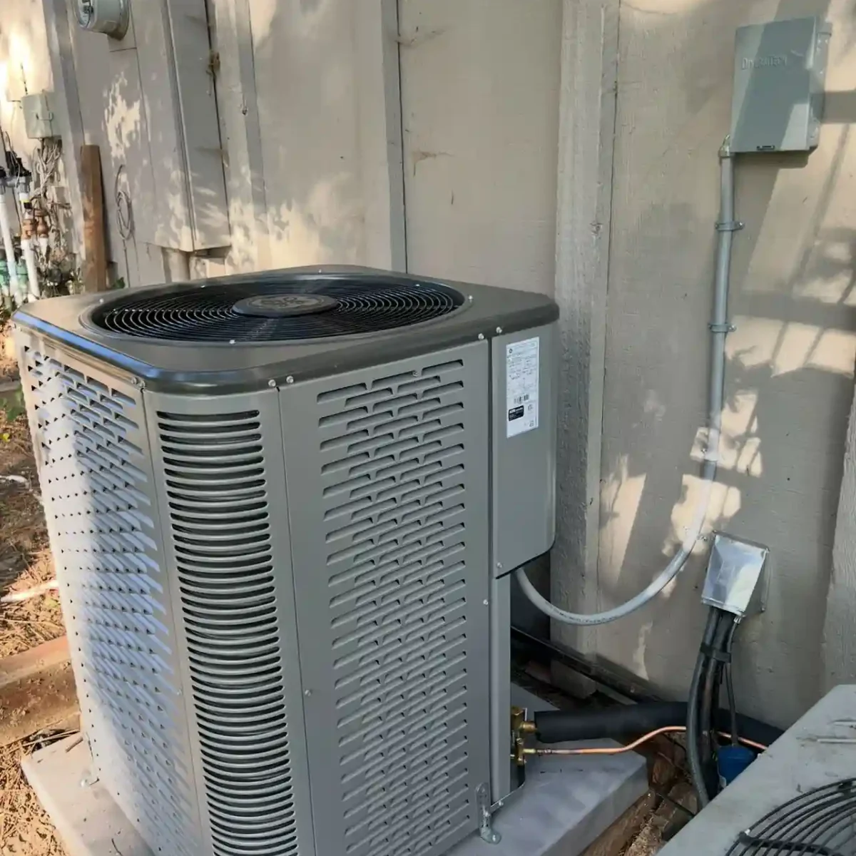 Outdoor air conditioning system connected to a home.